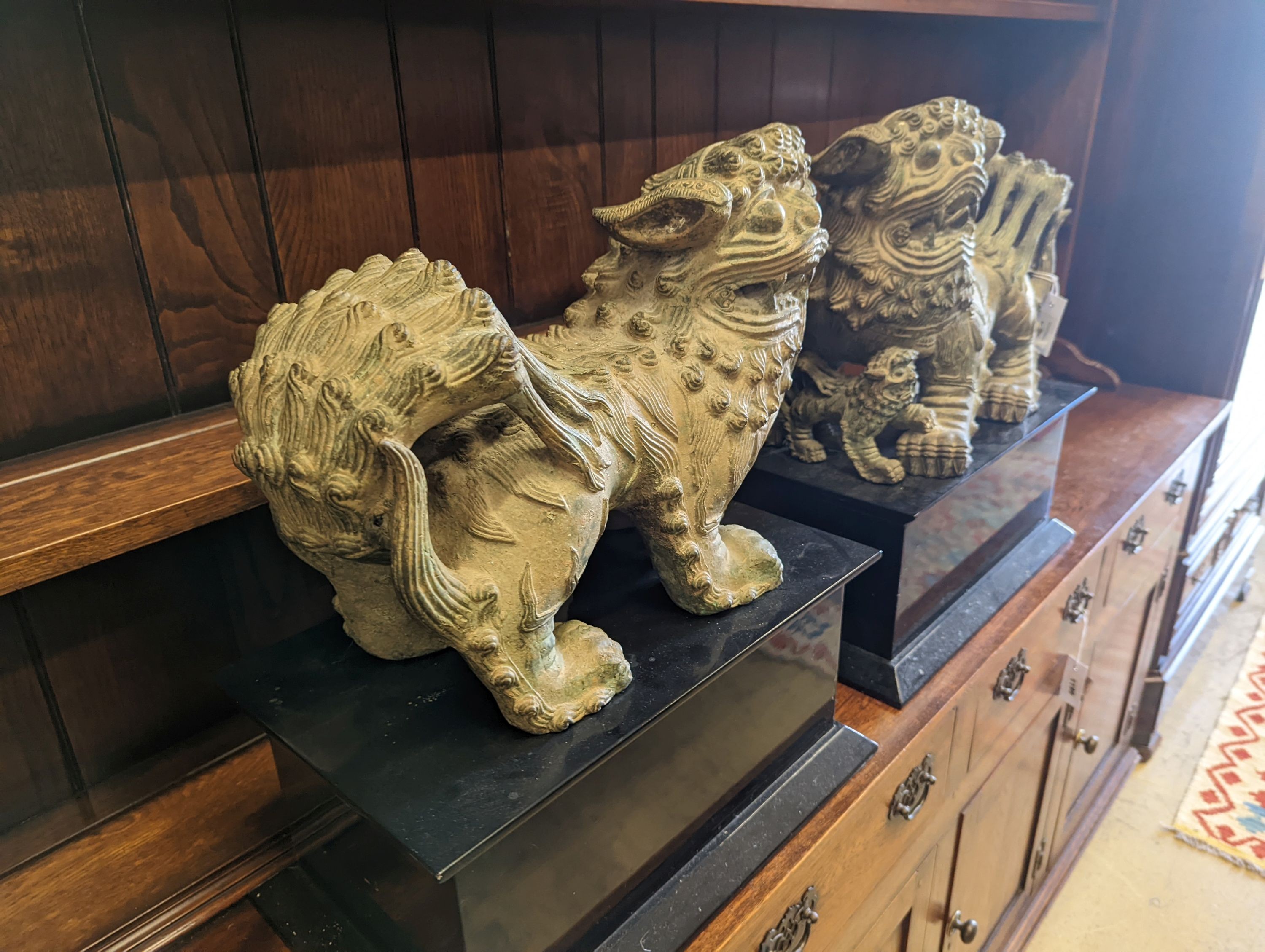 A pair of modern Chinese bronze shi-shi, width 45cm, depth 24cm, height 54cm